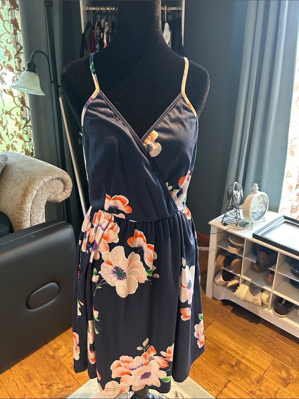 Navy Floral Mini Dress with Spaghetti Straps and side pockets.